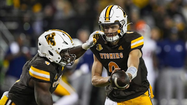 Oct 7, 2023; Laramie, Wyoming, USA; Wyoming Cowboys quarterback Andrew Peasley (6) hands off to