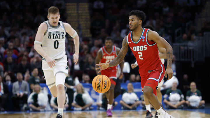 Mar 23, 2025; Cleveland, OH, USA; New Mexico Lobos guard Donovan Dent (2) dribbles in the second half against the Michigan State Spartans during the NCAA Tournament Second Round at Rocket Arena. Mandatory Credit: Rick Osentoski-Imagn Images