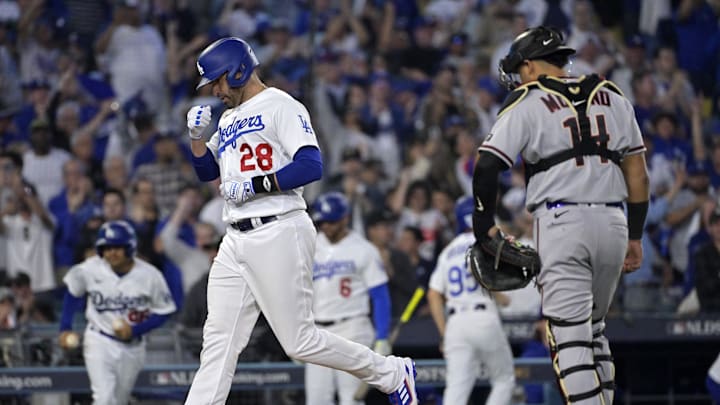 Oct 9, 2023; Los Angeles, California, USA; Los Angeles Dodgers designated hitter J.D. Martinez (28) reacts after hitting a home run against the Arizona Diamondbacks  during the fourth inning for game two of the NLDS for the 2023 MLB playoffs at Dodger Stadium. Mandatory Credit: Jayne Kamin-Oncea-Imagn Images