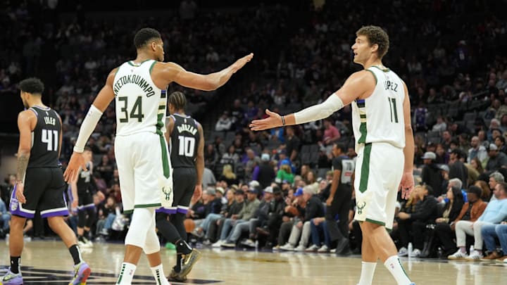 Mar 22, 2025; Sacramento, California, USA; Milwaukee Bucks forward Giannis Antetokounmpo (34) and center Brook Lopez (11) celebrate after defeating the Sacramento Kings at Golden 1 Center. Mandatory Credit: Darren Yamashita-Imagn Images Mar 22, 2025; Sacramento, California, USA; Milwaukee Bucks forward Giannis Antetokounmpo (34) and center Brook Lopez (11) celebrate after defeating the Sacramento Kings at Golden 1 Center. Mandatory Credit: Darren Yamashita-Imagn Images