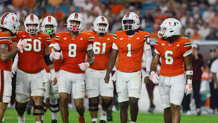 Sep 27, 2024; Miami Gardens, Florida, USA; Miami Hurricanes quarterback Cam Ward (1) looks on from the field against the Virginia Tech Hokies during the first quarter at Hard Rock Stadium. Mandatory Credit: Sam Navarro-Imagn Images