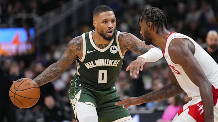 Nov 18, 2024; Milwaukee, Wisconsin, USA;  Milwaukee Bucks guard Damian Lillard (0) dribbles the ball against Houston Rockets forward Tari Eason (17) during the fourth quarter at Fiserv Forum. Mandatory Credit: Jeff Hanisch-Imagn Images
