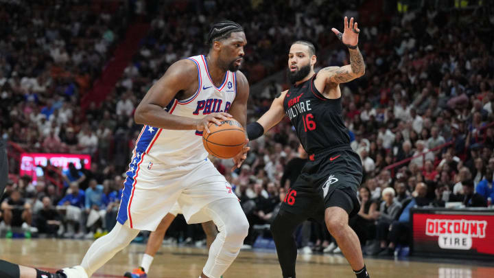 Apr 4, 2024; Miami, Florida, USA;  Philadelphia 76ers center Joel Embiid (21) drives past Miami Heat