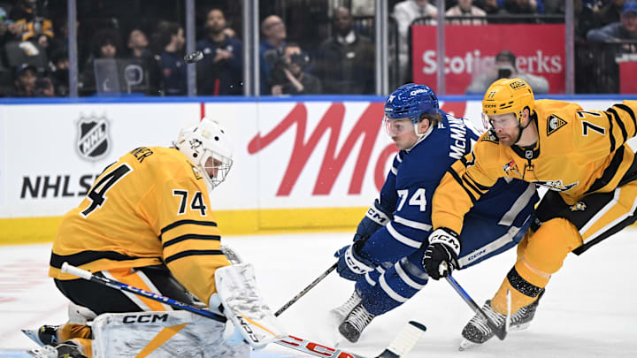 Dec 23, 2025; Toronto, Ontario, CAN;  Pittsburgh Penguins goalie Stuart Skinner (74) stops a scoring attempt from Toronto Maple Leafs forward Bobby McMann (74) as defenseman Brett Kulak (77) trails the play in the first period at Scotiabank Arena. Mandatory Credit: Dan Hamilton-Imagn Images