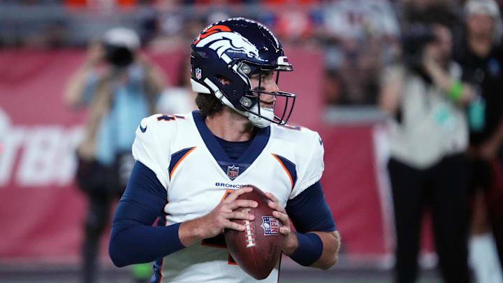 Aug 11, 2023; Glendale, Arizona, USA; Denver Broncos quarterback Jarrett Stidham (4) drops back to