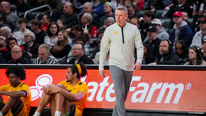 Feb 5, 2026; Cincinnati, Ohio, USA;  West Virginia Mountaineers head coach Ross Hodge works the sideline against the Cincinnati Bearcats in the first half at Fifth Third Arena. Mandatory Credit: Aaron Doster-Imagn Images