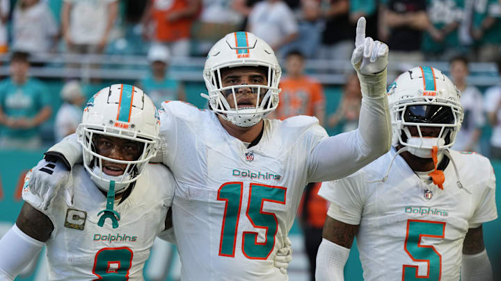 Miami Dolphins linebacker Jaelan Phillips (15) celebrates an interception during the second half of an NFL game against the Las Vegas Raiders with teammates safety Jevon Holland (8) and cornerback Jalen Ramsey (5) at Hard Rock Stadium in Miami Gardens, Nov. 19, 2023.
