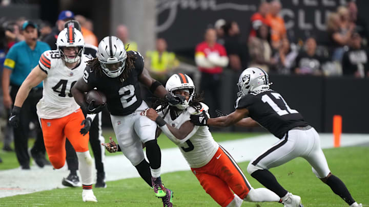 Nov 23, 2025; Paradise, Nevada, USA; Las Vegas Raiders running back Ashton Jeanty (2) runs against Cleveland Browns safety Rayshawn Jenkins (5) in the first half at Allegiant Stadium. Mandatory Credit: Kirby Lee-Imagn Images