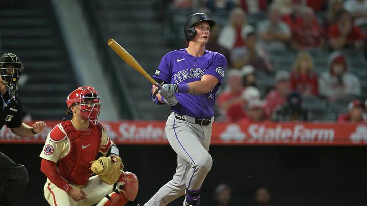 Jun 1, 2026; Anaheim, California, USA; Colorado Rockies first baseman TJ Rumfield (7) hits a sacrifice fly in the eighth inning to score the winning run against the Los Angeles Angels at Angel Stadium. Mandatory Credit: Jayne Kamin-Oncea-Imagn Images