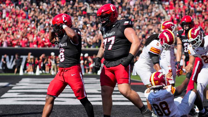 Oct 4, 2025; Cincinnati, Ohio, USA; Cincinnati Bearcats running back Evan Pryor (6) celebrates scoring a touchdown with offensive lineman Taran Tyo (77) in the game against the Iowa State Cyclones in the first half at Nippert Stadium. Mandatory Credit: Aaron Doster-Imagn Images Oct 4, 2025; Cincinnati, Ohio, USA; Cincinnati Bearcats running back Evan Pryor (6) celebrates scoring a touchdown with offensive lineman Taran Tyo (77) in the game against the Iowa State Cyclones in the first half at Nippert Stadium. Mandatory Credit: Aaron Doster-Imagn Images