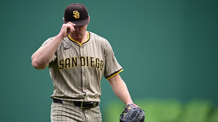 Pittsburgh, Pennsylvania, USA; San Diego Padres starting pitcher Stephen Kolek (32) tips his hat while walking to the dugout after a double play during the fourth inning against the Pittsburgh Pirates at PNC Park.
