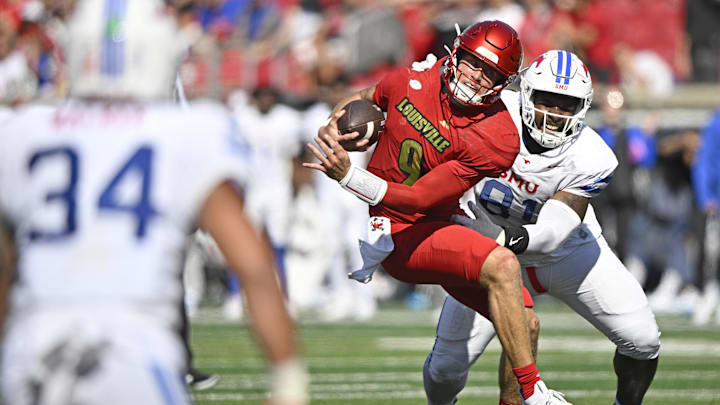 Oct 5, 2024; Louisville, Kentucky, USA;  Southern Methodist Mustangs defensive lineman Jared Harrison-Hunte (81) sacks Louisville Cardinals quarterback Tyler Shough (9) during the second half at L&N Federal Credit Union Stadium. Mandatory Credit: Jamie Rhodes-Imagn Images