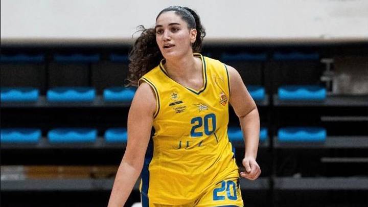 Maya Zilbershlag dribbles the basketball. Maya Zilbershlag dribbles the basketball.
