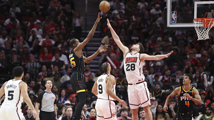 Mar 12, 2025; Houston, Texas, USA; Phoenix Suns forward Kevin Durant (35) shoots the ball as Houston Rockets center Alperen Sengun (28) defends during the third quarter at Toyota Center. Mandatory Credit: Troy Taormina-Imagn Images