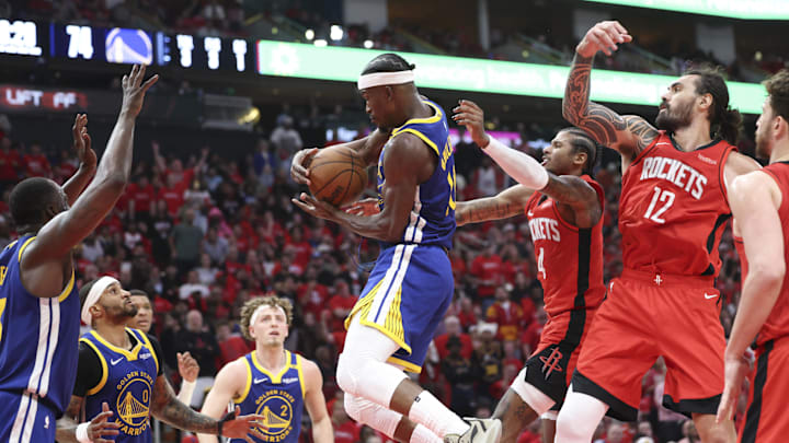 Apr 20, 2025; Houston, Texas, USA; Golden State Warriors forward Jimmy Butler III (10) grabs a rebound during the fourth quarter against the Houston Rockets at Toyota Center. Mandatory Credit: Troy Taormina-Imagn Images