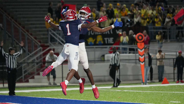 Manatee's Kei'Shawn Smith (#1) celebrates a touchdown with teammate Farrakhan Shannon (#14). The Manatee Hurricanes defeated visiting Immokalee 54-8, at Joe Kinnan Field at Hawkins Stadium during the Class 5A-Region 3 regional semifinal playoff game Friday night, Nov. 22, 2024, in Bradenton.