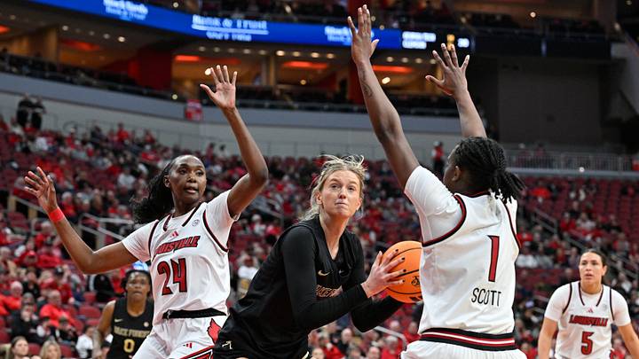 Feb 12, 2026; Louisville, Kentucky, USA; Louisville Cardinals forward Grace Mbugua (24) and guard Reyna Scott (1) defend Wake Forest Demon Deacons forward Opal Bird (9) during the second half at KFC Yum! Center. Louisville defeated Wake Forest 86-67. Mandatory Credit: Jamie Rhodes-Imagn Images Feb 12, 2026; Louisville, Kentucky, USA; Louisville Cardinals forward Grace Mbugua (24) and guard Reyna Scott (1) defend Wake Forest Demon Deacons forward Opal Bird (9) during the second half at KFC Yum! Center. Louisville defeated Wake Forest 86-67. Mandatory Credit: Jamie Rhodes-Imagn Images