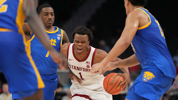 Mar 10, 2026; Charlotte, NC, USA; Stanford Cardinal guard Ebuka Okorie (1) with the ball as Pittsburgh Panthers guard Damarco Minor (7) and forward Roman Siulepa (13) defend in the second half at Spectrum Center. Mandatory Credit: Bob Donnan-Imagn Images