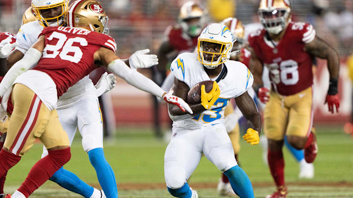 Los Angeles Chargers running back Aaron Shampklin (23) runs with the football during the fourth quarter against San Francisco 49ers cornerback Isaiah Oliver (26) at Levi's Stadium in 2023. Los Angeles Chargers running back Aaron Shampklin (23) runs with the football during the fourth quarter against San Francisco 49ers cornerback Isaiah Oliver (26) at Levi's Stadium in 2023.