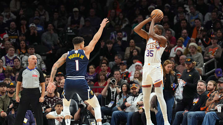 Dec 25, 2024; Phoenix, Arizona, USA; Phoenix Suns forward Kevin Durant (35) shoots over Denver Nuggets forward Michael Porter Jr. (1) during the second half at Footprint Center. Mandatory Credit: Joe Camporeale-Imagn Images Dec 25, 2024; Phoenix, Arizona, USA; Phoenix Suns forward Kevin Durant (35) shoots over Denver Nuggets forward Michael Porter Jr. (1) during the second half at Footprint Center. Mandatory Credit: Joe Camporeale-Imagn Images