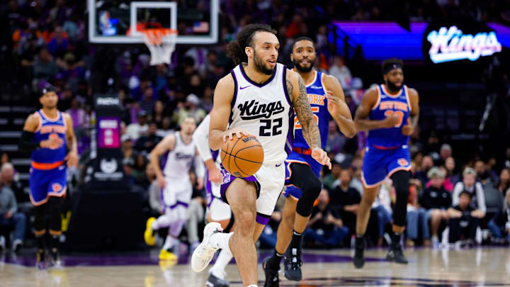 Mar 10, 2025; Sacramento, California, USA; Sacramento Kings guard Devin Carter (22) dribbles the ball up the court against the New York Knicks during the fourth quarter at Golden 1 Center. Mandatory Credit: Sergio Estrada-Imagn Images