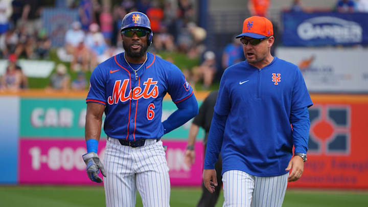 New York Mets right fielder Starling Marte (6) and manager Carlos Mendoza walk back to the dugout after Marte was called out for interference in the first inning against the Houston Astros at Clover Park. 