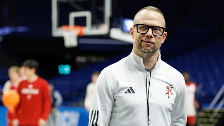 Mar 19, 2025; Lexington, KY, USA; Louisville Cardinals head coach Pat Kelsey talks to media members on the sideline during practice at Rupp Arena. Mandatory Credit: Jordan Prather-Imagn Images