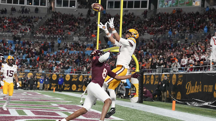 Jan 3, 2025; Charlotte, NC, USA; Minnesota Golden Gophers wide receiver Elijah Spencer (11) catches a pass for a touchdown defended but Virginia Tech Hokies cornerback Braylon Johnson (8) during the second quarter at the Duke’s Mayo Bowl at Bank of America Stadium. Mandatory Credit: Jim Dedmon-Imagn Images Jan 3, 2025; Charlotte, NC, USA; Minnesota Golden Gophers wide receiver Elijah Spencer (11) catches a pass for a touchdown defended but Virginia Tech Hokies cornerback Braylon Johnson (8) during the second quarter at the Duke’s Mayo Bowl at Bank of America Stadium. Mandatory Credit: Jim Dedmon-Imagn Images