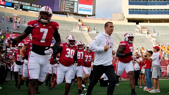 Sep 12, 2026; Madison, Wisconsin, USA;  Wisconsin Badgers head coach Luke Fickell leads the team onto the field for warmups prior to the game against the Western Illinois Leathernecks at Camp Randall Stadium. Mandatory Credit: Jeff Hanisch-Imagn Images