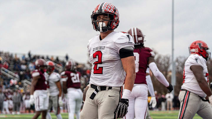 Marcello Vitti (2) of Divine Child stands on the end zone after scoring a rushing touchdown against Harper Woods during the Division 4 regional final at John Glenn High School in Westland on Saturday, Nov. 15, 2025.