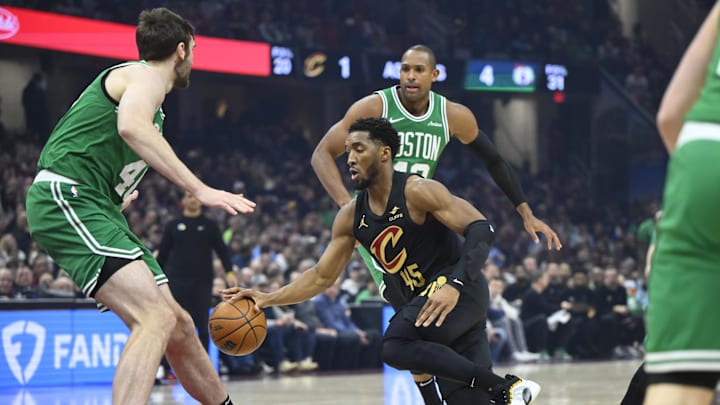 Feb 4, 2025; Cleveland, Ohio, USA; Cleveland Cavaliers guard Donovan Mitchell (45) dribbles in the first quarter against the Boston Celtics at Rocket Mortgage FieldHouse. Mandatory Credit: David Richard-Imagn Images