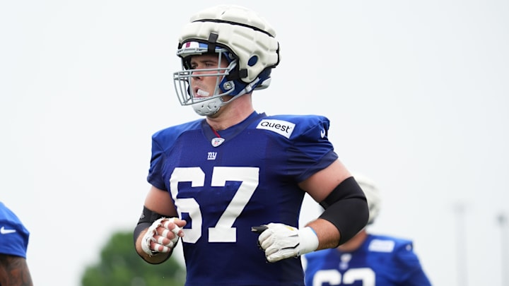 Jul 25, 2024; East Rutherford, NY, USA; New York Giants center Jimmy Morrissey (67) jogs to the sideline during training camp at Quest Diagnostics Training Center. 