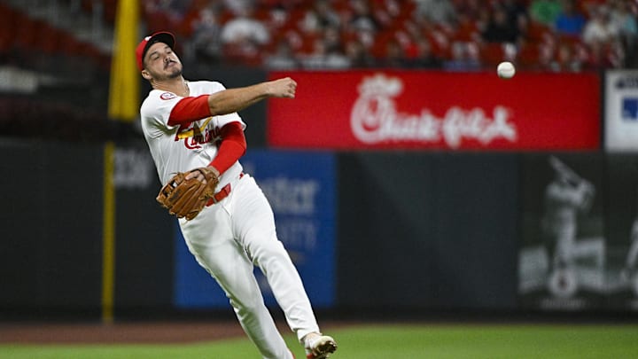 Aug 20, 2024; St. Louis, Missouri, USA;  St. Louis Cardinals third baseman Nolan Arenado (28) throws on the run against the Milwaukee Brewers during the seventh inning and at Busch Stadium. Mandatory Credit: Jeff Curry-Imagn Images