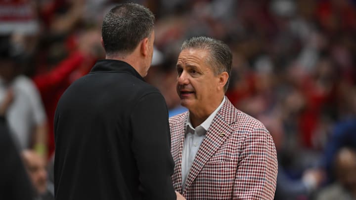 Mar 15, 2026; Nashville, TN, USA; Vanderbilt Commodores head coach Mark Byington congratulates Arkansas Razorbacks head coach John Calipari on the win during the men's SEC Conference Tournament Championship at Bridgestone Arena. Mandatory Credit: Steve Roberts-Imagn Images