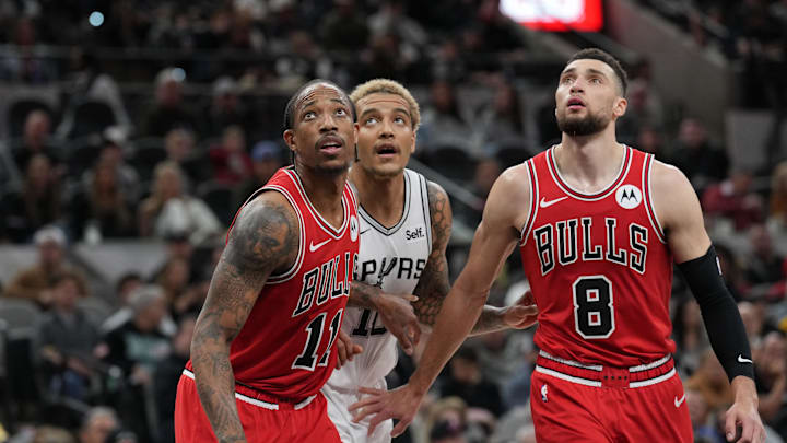Jan 13, 2024; San Antonio, Texas, USA;  Chicago Bulls forward DeMar DeRozan (11) and guard Zach LaVine (8) block out San Antonio Spurs forward Jeremy Sochan (10) in the second half at Frost Bank Center. Mandatory Credit: Daniel Dunn-Imagn Images