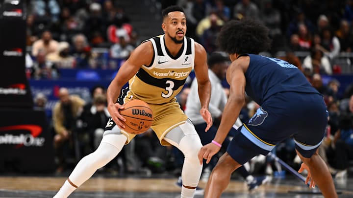 Dec 28, 2025; Washington, District of Columbia, USA; Washington Wizards guard CJ McCollum (3) dribbles against the Memphis Grizzlies during the second half at Capital One Arena. Mandatory Credit: Brad Mills-Imagn Images