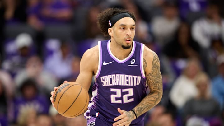 Apr 10, 2026; Sacramento, California, USA; Sacramento Kings guard Devin Carter (22) brings the ball upcourt against the Golden State Warriors during the first quarter at Golden 1 Center. Mandatory Credit: Robert Edwards-Imagn Images
