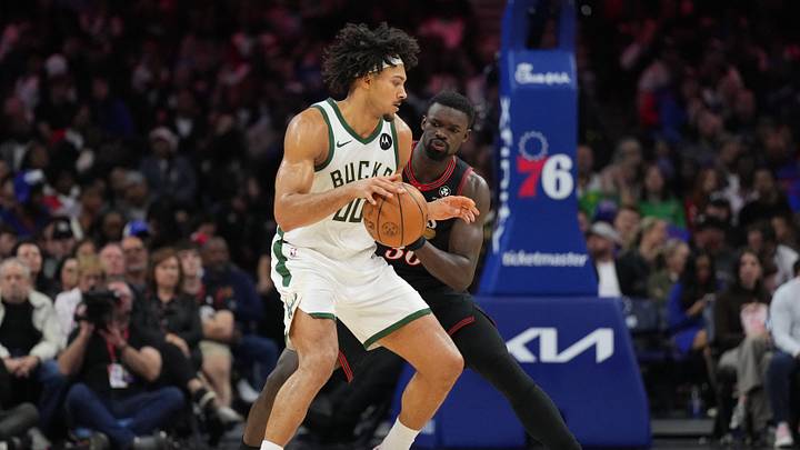 Apr 12, 2026; Philadelphia, Pennsylvania, USA; Milwaukee Bucks center Jericho Sims (00) controls the ball against Philadelphia 76ers center Adem Bona (30) in the fourth quarter at Xfinity Mobile Arena. Mandatory Credit: Kyle Ross-Imagn Images