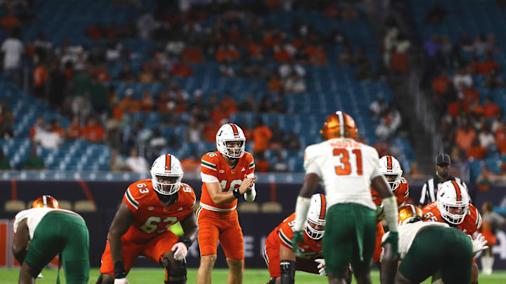 Sep 7, 2024; Miami Gardens, Florida, USA; Miami Hurricanes quarterback Reese Poffenbarger (16) calls for the snap against the Florida A&M Rattlers during the fourth quarter at Hard Rock Stadium. Mandatory Credit: Sam Navarro-Imagn Images