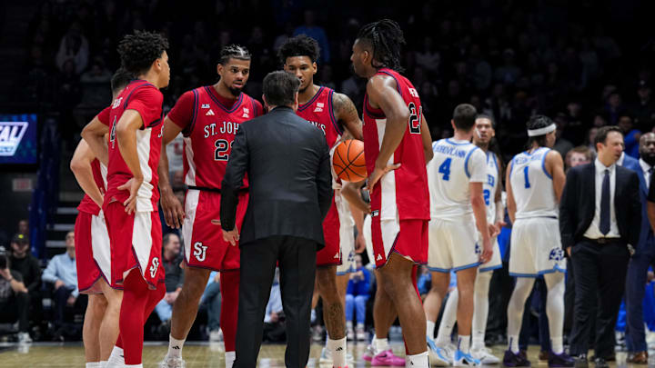 Jan 24, 2026; Cincinnati, Ohio, USA; St. John's basketball head coach Rick Pitino leads a team huddle during a stop in play against the Xavier Musketeers in the second half at the Cintas Center. Jan 24, 2026; Cincinnati, Ohio, USA; St. John's basketball head coach Rick Pitino leads a team huddle during a stop in play against the Xavier Musketeers in the second half at the Cintas Center.