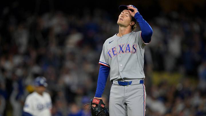Apr 10, 2026; Los Angeles, California, USA; Texas Rangers pitcher Jacob Latz (67) walks off the field after giving up a walk-off home run to Los Angeles Dodgers third baseman Max Muncy (13) in the ninth inning at Dodger Stadium. Mandatory Credit: Jayne Kamin-Oncea-Imagn Images