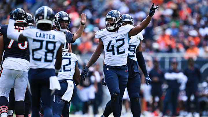 Aug 12, 2023; Chicago, Illinois, USA;  Tennessee Titans outside linebacker Caleb Murphy (42) celebrates after sacking the Chicago Bears quarterback in the second half at Soldier Field. Mandatory Credit: Jamie Sabau-Imagn Images