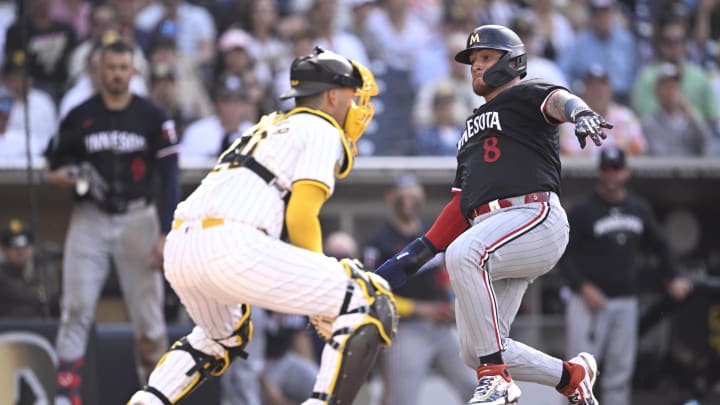 Aug 21, 2024; San Diego, California, USA; Minnesota Twins catcher Christian Vazquez (8) scores a run past San Diego Padres catcher Kyle Higashioka (20) during the fourth inning at Petco Park. Mandatory Credit: Orlando Ramirez-USA TODAY Sports Aug 21, 2024; San Diego, California, USA; Minnesota Twins catcher Christian Vazquez (8) scores a run past San Diego Padres catcher Kyle Higashioka (20) during the fourth inning at Petco Park. Mandatory Credit: Orlando Ramirez-USA TODAY Sports