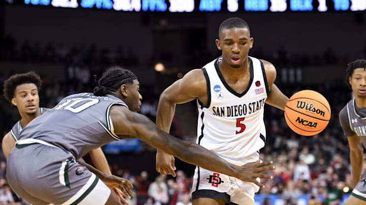 Mar 22, 2024; Spokane, WA, USA; San Diego State Aztecs guard Lamont Butler (5) drives to the basket