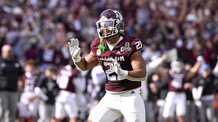 Dec 20, 2025; College Station, TX, USA; Texas A&M Aggies linebacker Taurean York (21) celebrates during the game between the Aggies and the Hurricanes at Kyle Field. Mandatory Credit: Jerome Miron-Imagn Images