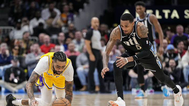 Jan 30, 2024; Atlanta, Georgia, USA; Los Angeles Lakers guard D'Angelo Russell (1) loses and dives