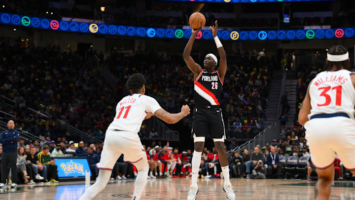Oct 11, 2024; Seattle, Washington, USA; Portland Trail Blazers center Duop Reath (26) shoots the ball over Los Angeles Clippers guard Jordan Miller (11) during the second half at Climate Pledge Arena. Mandatory Credit: Steven Bisig-Imagn Images