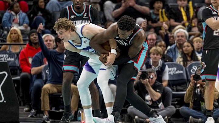 Dec 12, 2025; Memphis, Tennessee, USA; Utah Jazz forward Lauri Markkanen (23) and Memphis Grizzlies power forward Jaren Jackson Jr. (8) fight for the ball in the second quarter at FedExForum. Mandatory Credit: Matthew Smith-Imagn Images