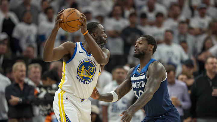 May 14, 2025; Minneapolis, Minnesota, USA; Golden State Warriors forward Draymond Green (23) holds the ball up as Minnesota Timberwolves forward Julius Randle (30) plays defense in the first half during game five of the second round for the 2025 NBA Playoffs at Target Center. Mandatory Credit: Jesse Johnson-Imagn Images May 14, 2025; Minneapolis, Minnesota, USA; Golden State Warriors forward Draymond Green (23) holds the ball up as Minnesota Timberwolves forward Julius Randle (30) plays defense in the first half during game five of the second round for the 2025 NBA Playoffs at Target Center. Mandatory Credit: Jesse Johnson-Imagn Images