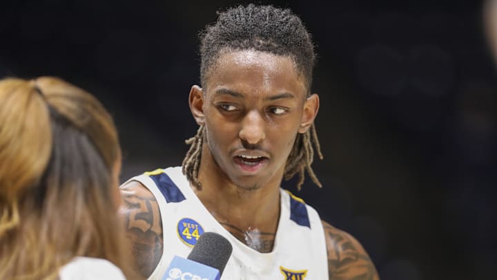 Feb 25, 2025; Morgantown, West Virginia, USA; West Virginia Mountaineers guard Javon Small (7) answers questions during a postgame interview after defeating the TCU Horned Frogs at WVU Coliseum. Mandatory Credit: Ben Queen-Imagn Images